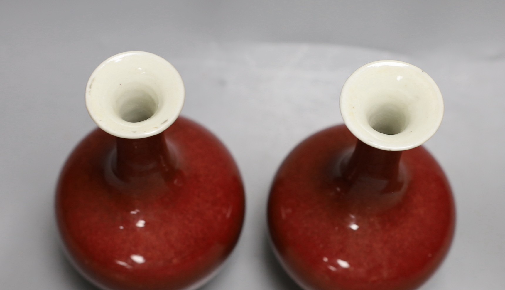 A pair of Chinese sang de boeuf glazed vases, early 20th century, 20cm high